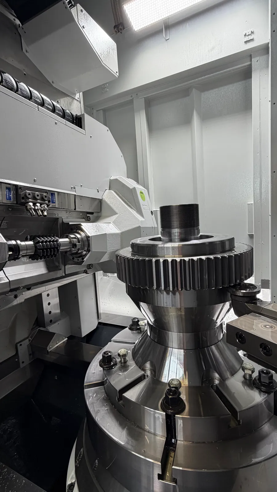 Long shaft turned between centers on a heavy engine lathe