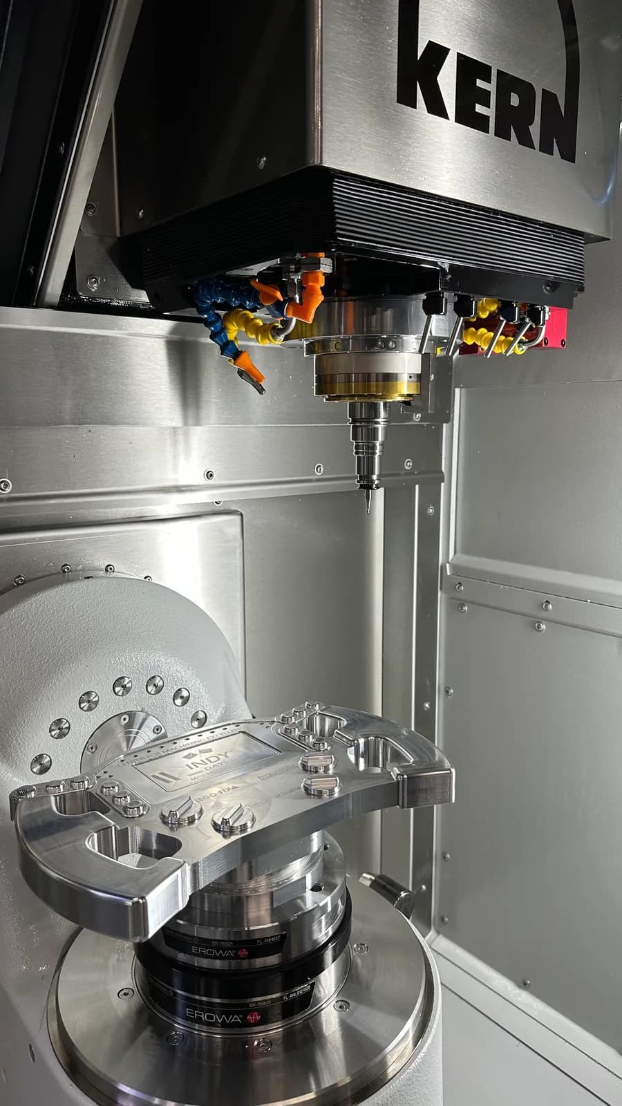 Trunnion-style 5-axis machining center mid-cycle