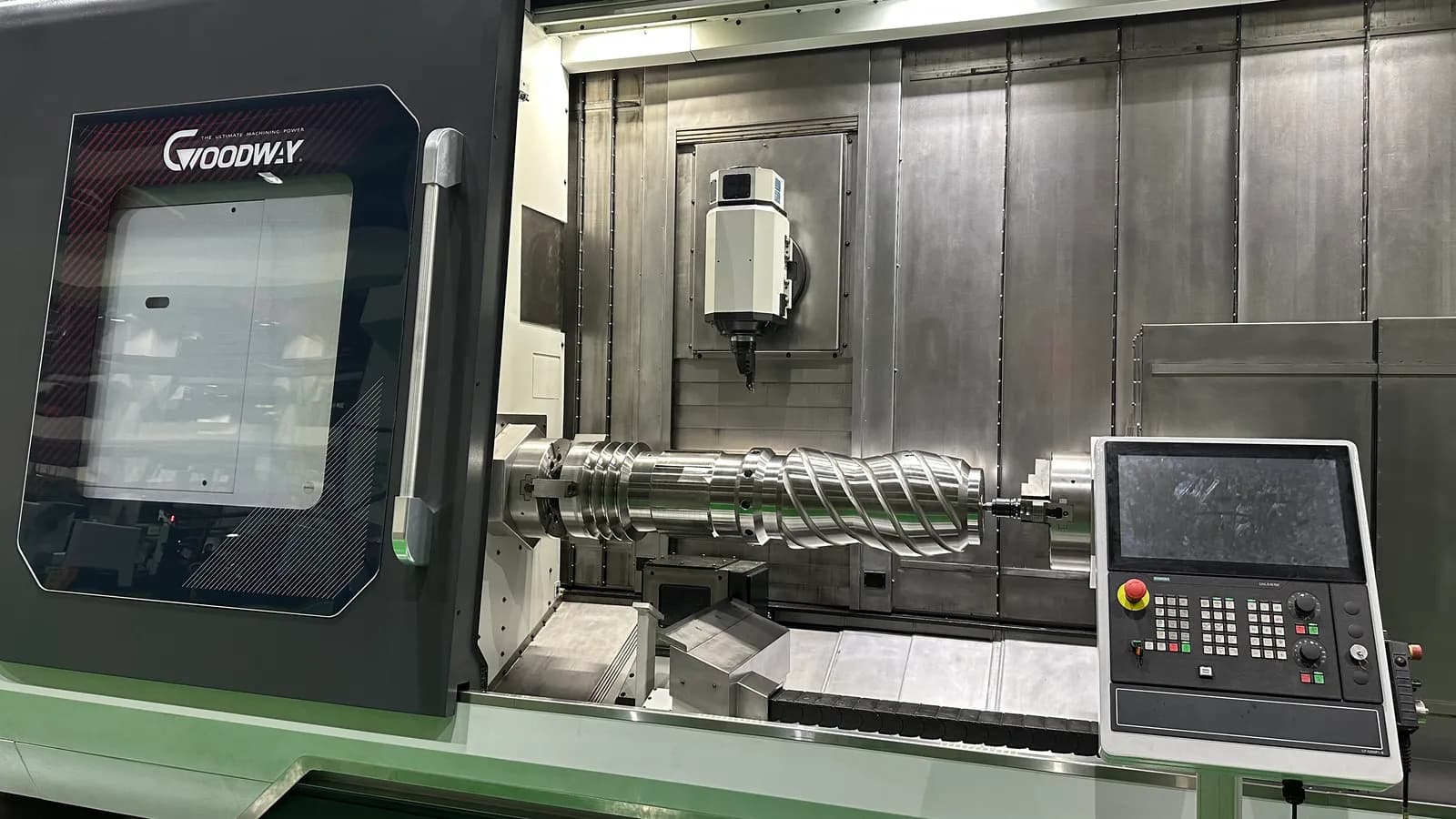 CNC machining center with a precision-turned component in the chuck